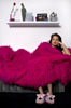 Portrait of a girl coverd in a pink blanket